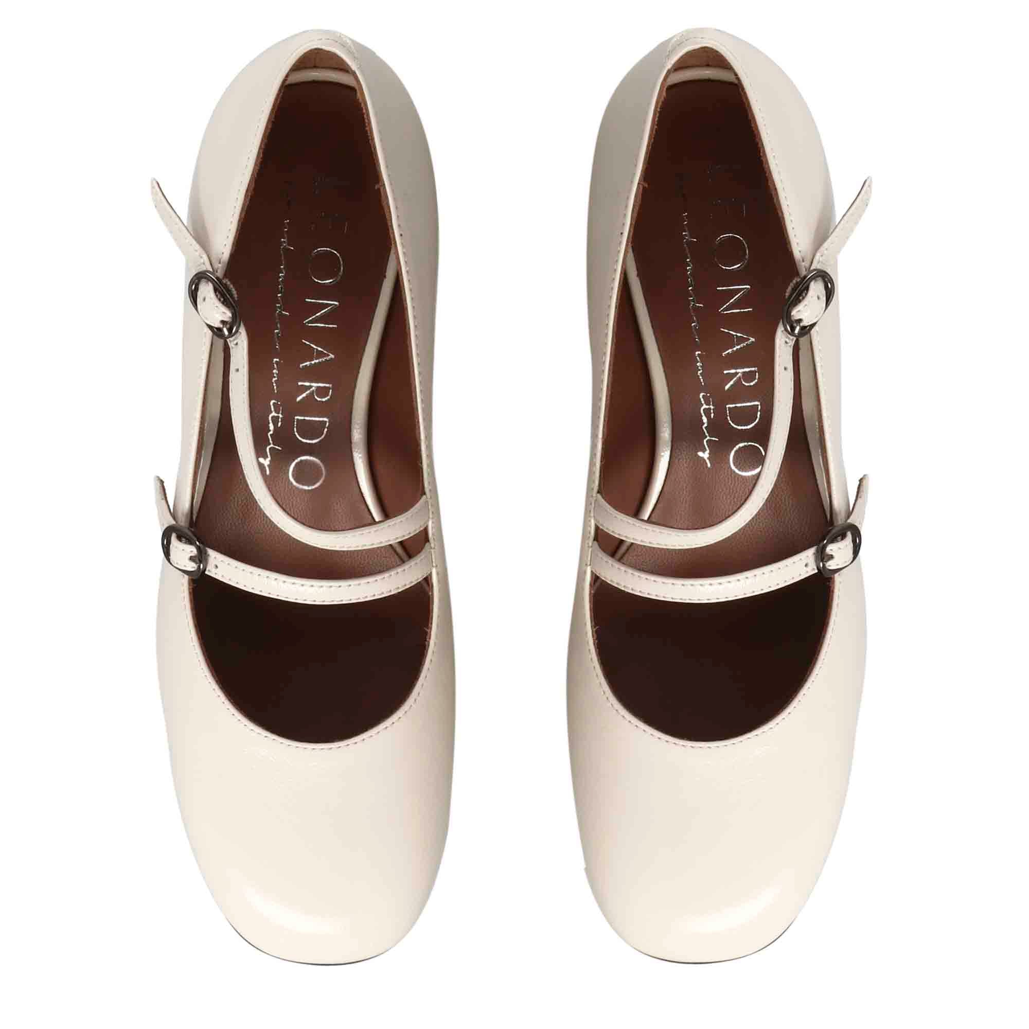 Mary Jane décolleté in beige patent leather with double strap