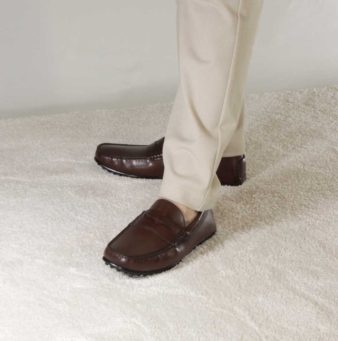 Casual men's moccasin in dark brown leather with rubber pebbled sole