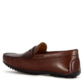 Casual men's moccasin in dark brown leather with rubber pebbled sole
